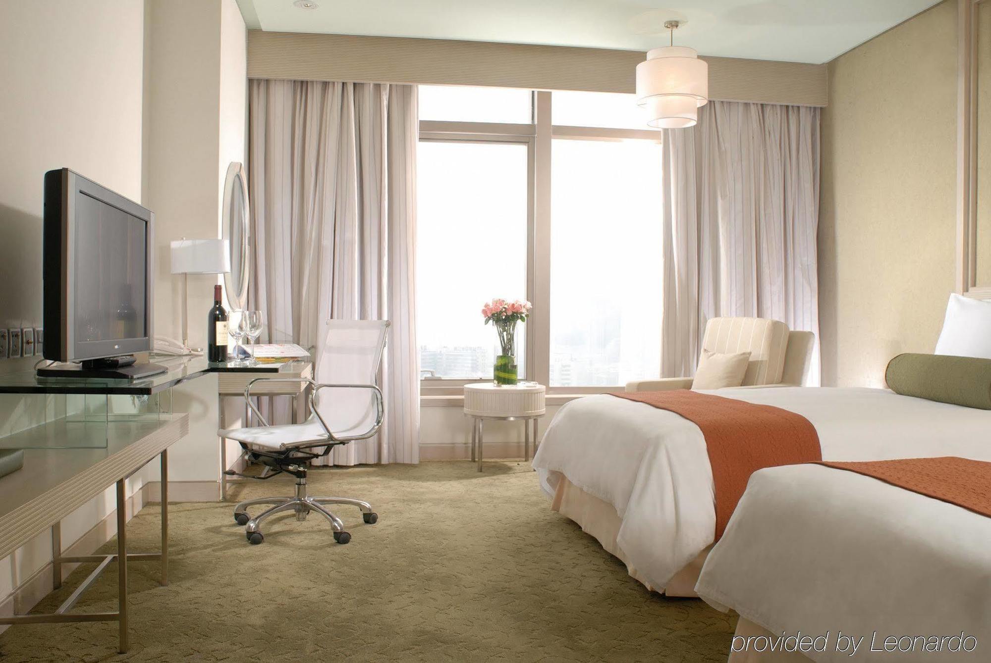 Hotel Nikko Τιαντζίν Δωμάτιο φωτογραφία A room at the hotel